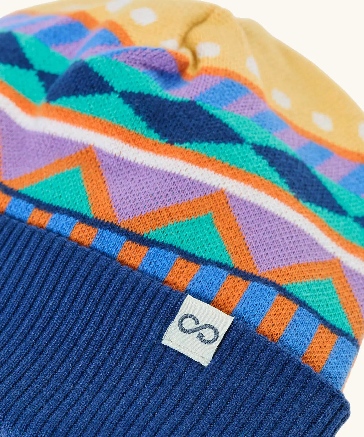 Frugi GOTS organic cotton voyager reversible hat showing close up of the winter fairisle design