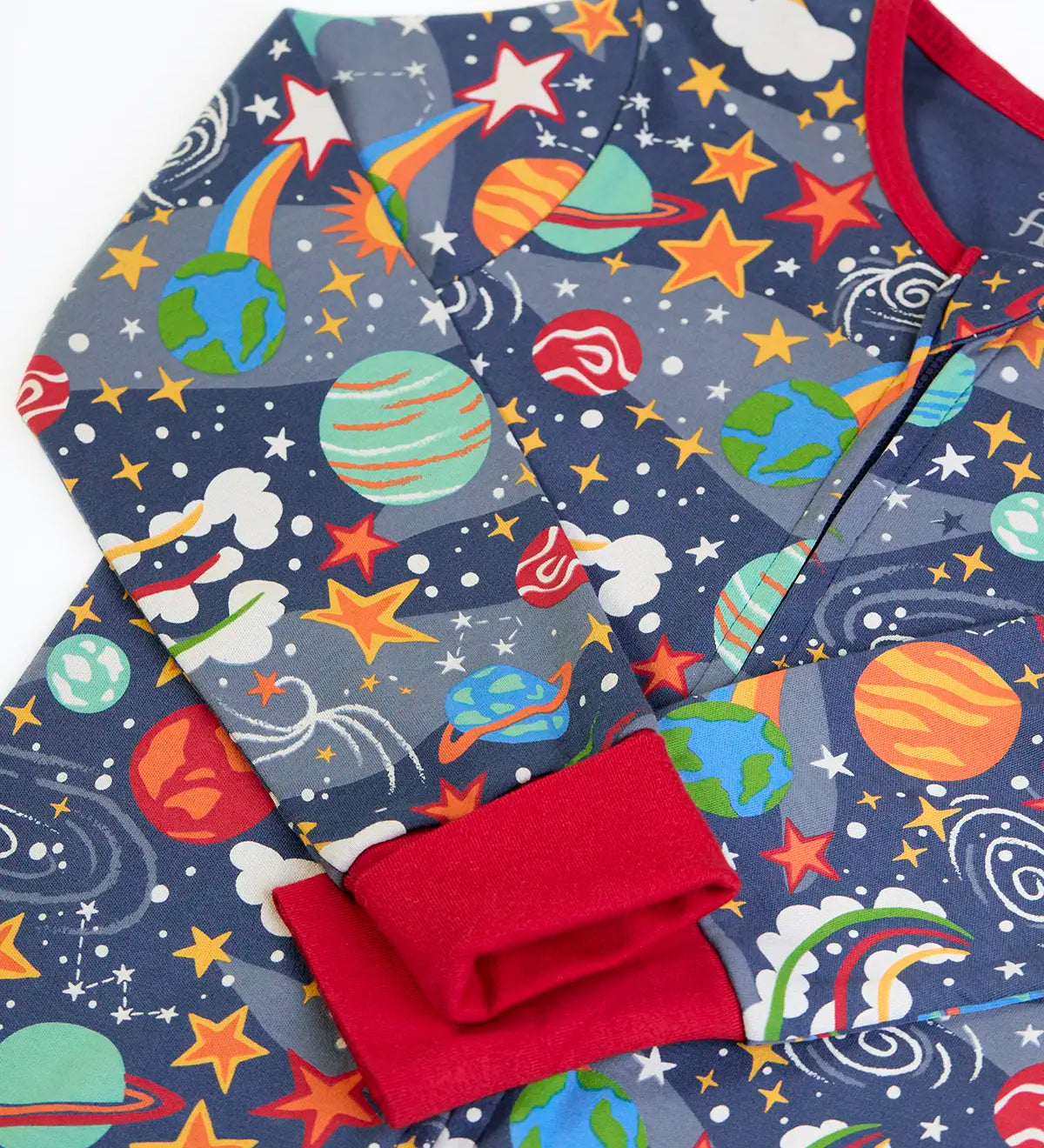 Frugi GOTS 100% organic cotton navy onesie laid flat showing a repeating outer space print, red cuffs and neck trim