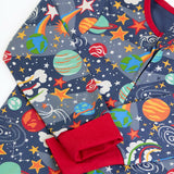 Frugi GOTS 100% organic cotton navy onesie laid flat showing a repeating outer space print, red cuffs and neck trim