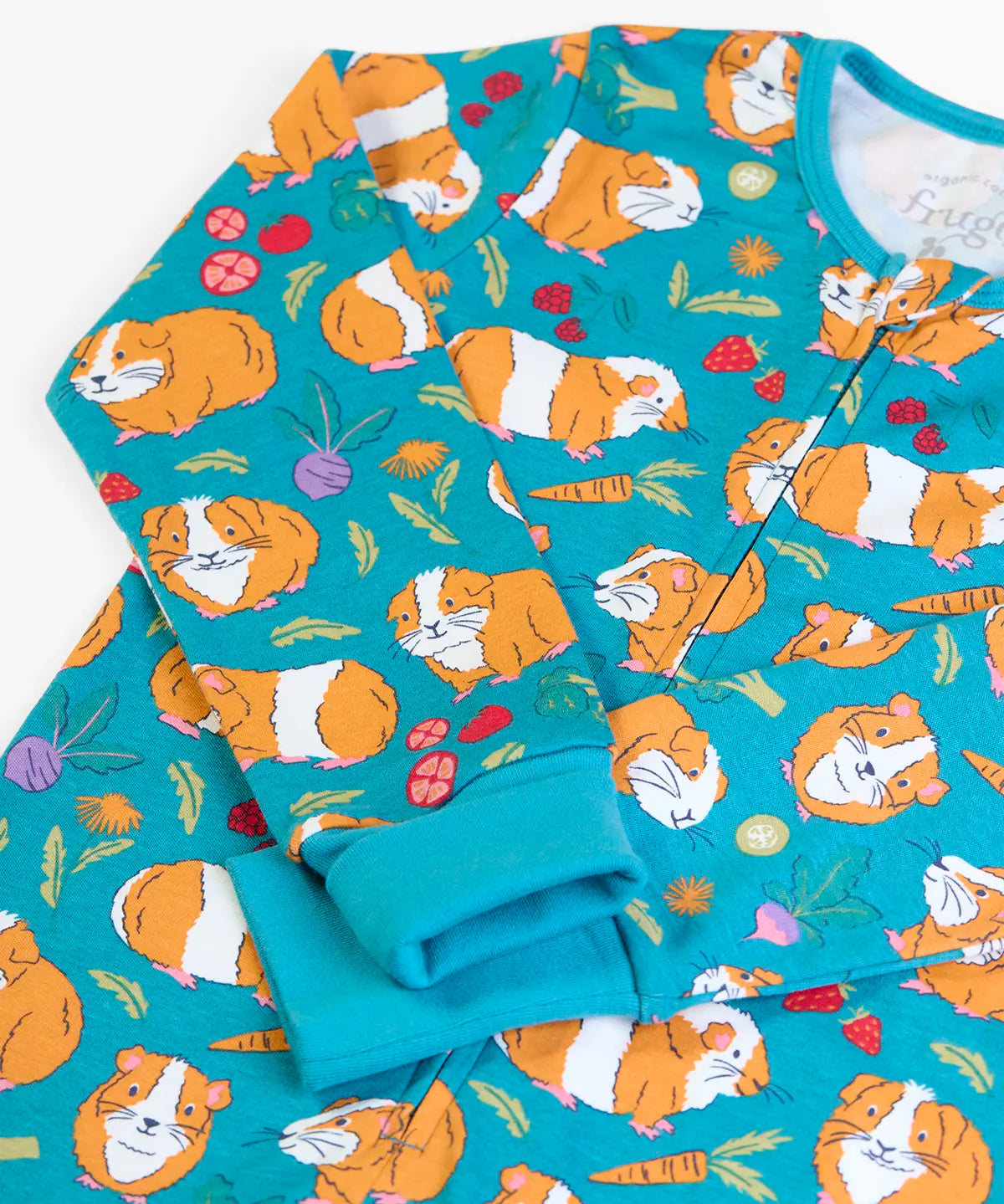 Frugi GOTS 100% organic cotton all in on in blue with a repeating guinea pig print showing the full front zip and fold up cuffs for extender wear