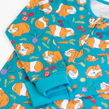Frugi GOTS 100% organic cotton all in on in blue with a repeating guinea pig print showing the full front zip and fold up cuffs for extender wear
