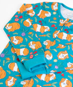 Frugi GOTS 100% organic cotton all in on in blue with a repeating guinea pig print showing the full front zip and fold up cuffs for extender wear