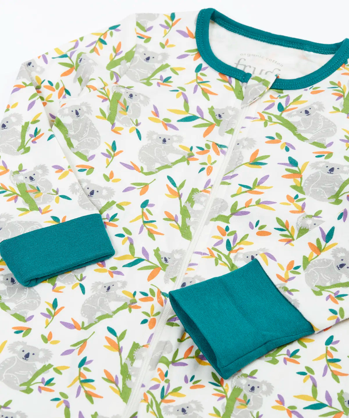 Frugi GOTS 100% organic cotton onesie in white with repeating koala printslaid flat showing the teal cuffs and neck trim dressing