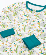 Frugi GOTS 100% organic cotton onesie in white with repeating koala printslaid flat showing the teal cuffs and neck trim dressing