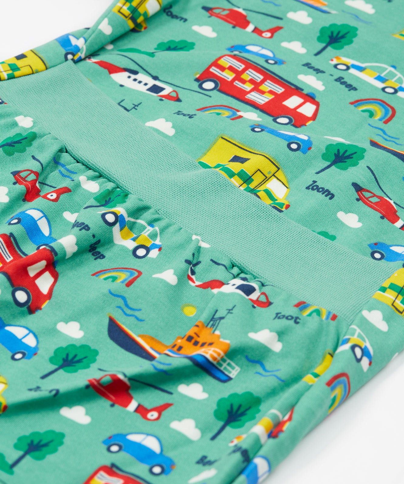 Frugi green dressing babygrow to the rescue print detail