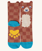 A close up of the Frugi bear character sock from the beary wild pack. A brown GOTS organic cotton sock with blue trim and a yellow paw on the sole.