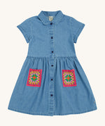 Frugi blue denim dress crochet pocket design on a cream background.