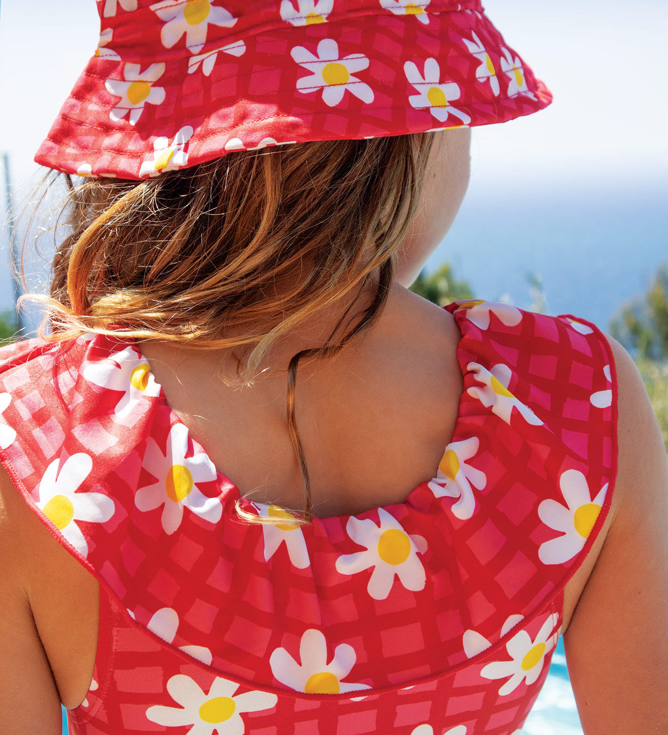 Frugi coral little swimsuit daisy chain design
