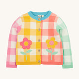 Frugi multicoloured check cardigan daisy design on a cream background.
