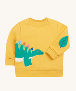 Frugi yellow easy on jumper dino design on a cream background.
