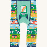 Frugi knitted leggings farm and tractor design on a cream background.