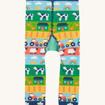 Frugi knitted leggings farm and tractor back detail on a cream background.