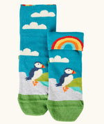 Frugi GOTS organic cotton socks showing a blue sky landscape with a puffin with details hidden under the cuff