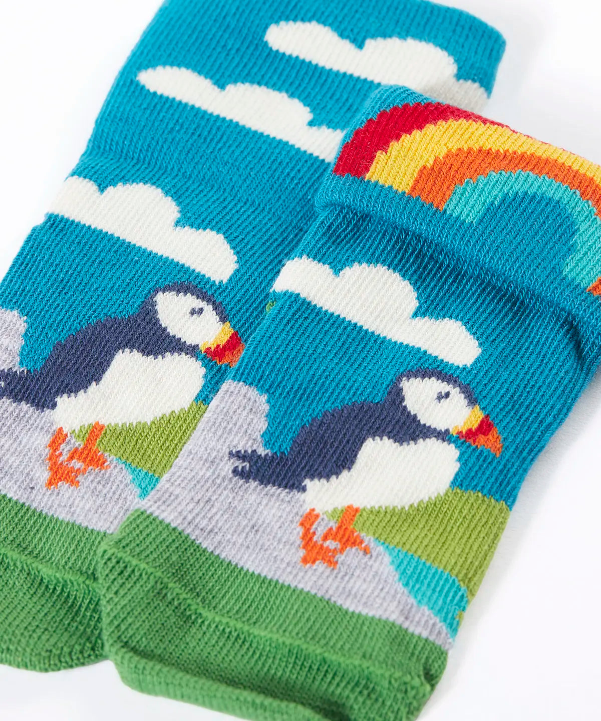 Frugi GOTS organic cotton sock showing one pair in sky blue with a perched puffin and rainbow and details hidden under the cuff