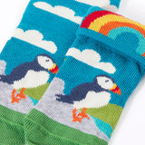 Frugi GOTS organic cotton sock showing one pair in sky blue with a perched puffin and rainbow and details hidden under the cuff