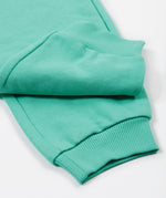 Frugi green crawler joggers daisy cuff detail