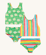 Frugi reversible tankini in a green daisy and summer stripe design on a cream background.