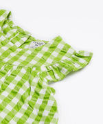 Close up of the Frugi little kids green gingham, donkey myrtle body dress - showing the gentle frill and back popper fastener detail on green and white gingham organic cotton fabric