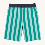 Frugi shorts in green stripes on a cream background.