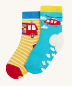 Frugi 2 pack grippy socks helicopter and fire engine design on a cream background.