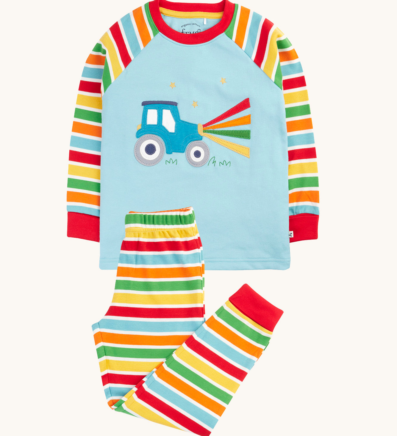 Frugi organic cotton pyjama set laid flat. A light blue top with striped sleeves and a tractor design on the front and matching striped trousers