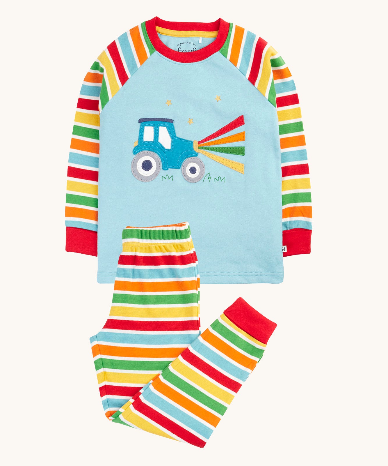 Frugi organic cotton pyjama set laid flat. A light blue top with striped sleeves and a tractor design on the front and matching striped trousers