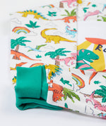 Frugi white pyjama set dinoland design cuff detail