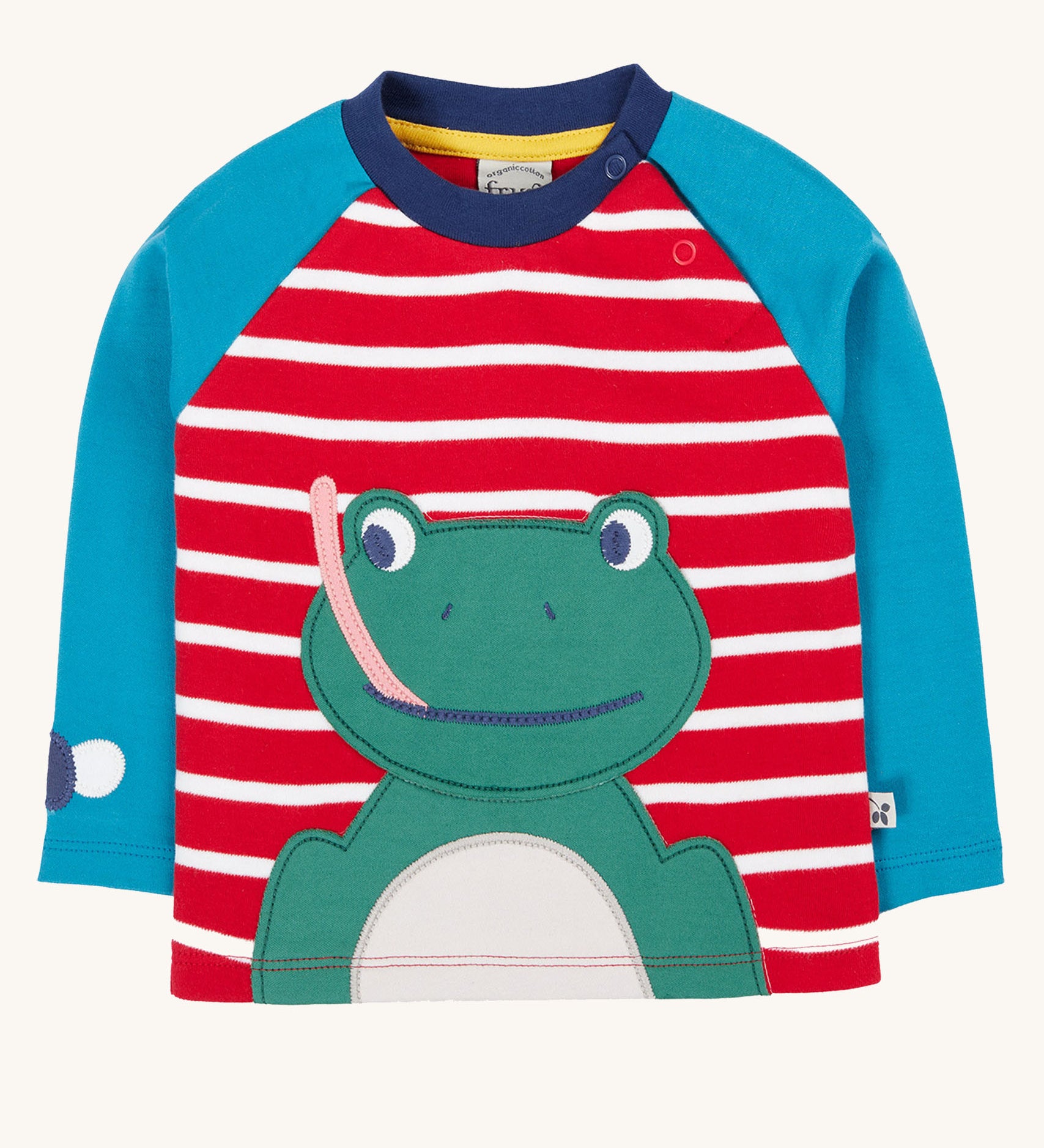 Frugi kids alfie raglan top in berry red/ breton frog available at Babipur. A GOTS organic cotton top with blue long sleeve and red/white stripes. Features a playful green frog applique on the front and popper fasteners on the shoulder.