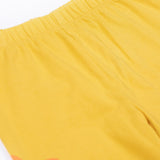 A close up of the Frugi kids luana bumblebee/flower leggings showin the soft elasticated waist band on yellow organic cotton fabric.