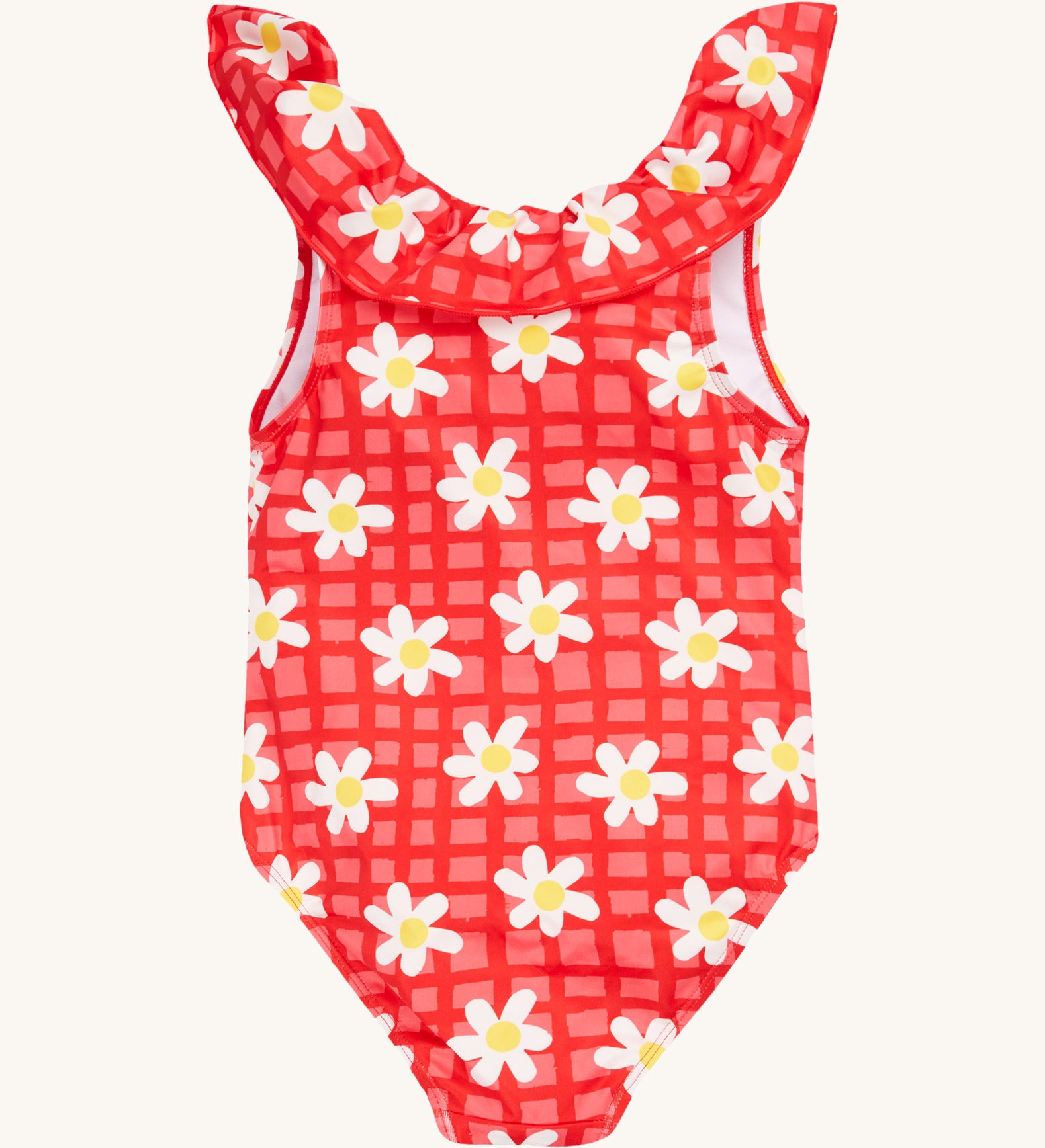 Frugi kids coral swim suit in check and daisy chain design on a cream background.