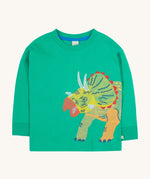Frugi kids green stop in a green colour with a triceratops design on a cream bakground.