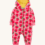 Frugi kids snuggle suit in strawberry design on a cream background