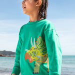 Frugi kids green stop in a green colour with a triceratops design