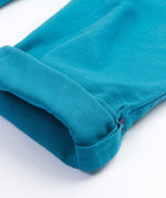 Frugi kids trousers in green, blue, turquoise colour turned up cuff detail
