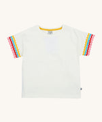 Frugi kids white short sleeve t-shirt with a rainbow trim on the sleeve on a cream background.