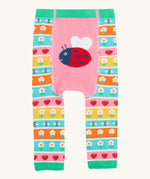 Frugi knitted leggings daisy and ladybird design on a cream background.