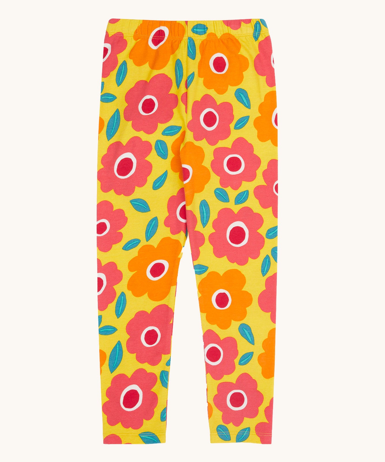 Frugi organic cotton leggings laid flat. In bright yellow with a repeating floral print