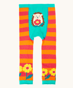 Frugi organic cotton knitted leggings. In orange and pink stripe with a hedgehog design on the front and yellow flowers on each leg