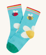 Frugi single little sock daisy design on a cream background