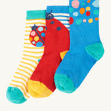 Frugi 3 pack organic cotton socks laid flat. In a ladybird themed design and colours