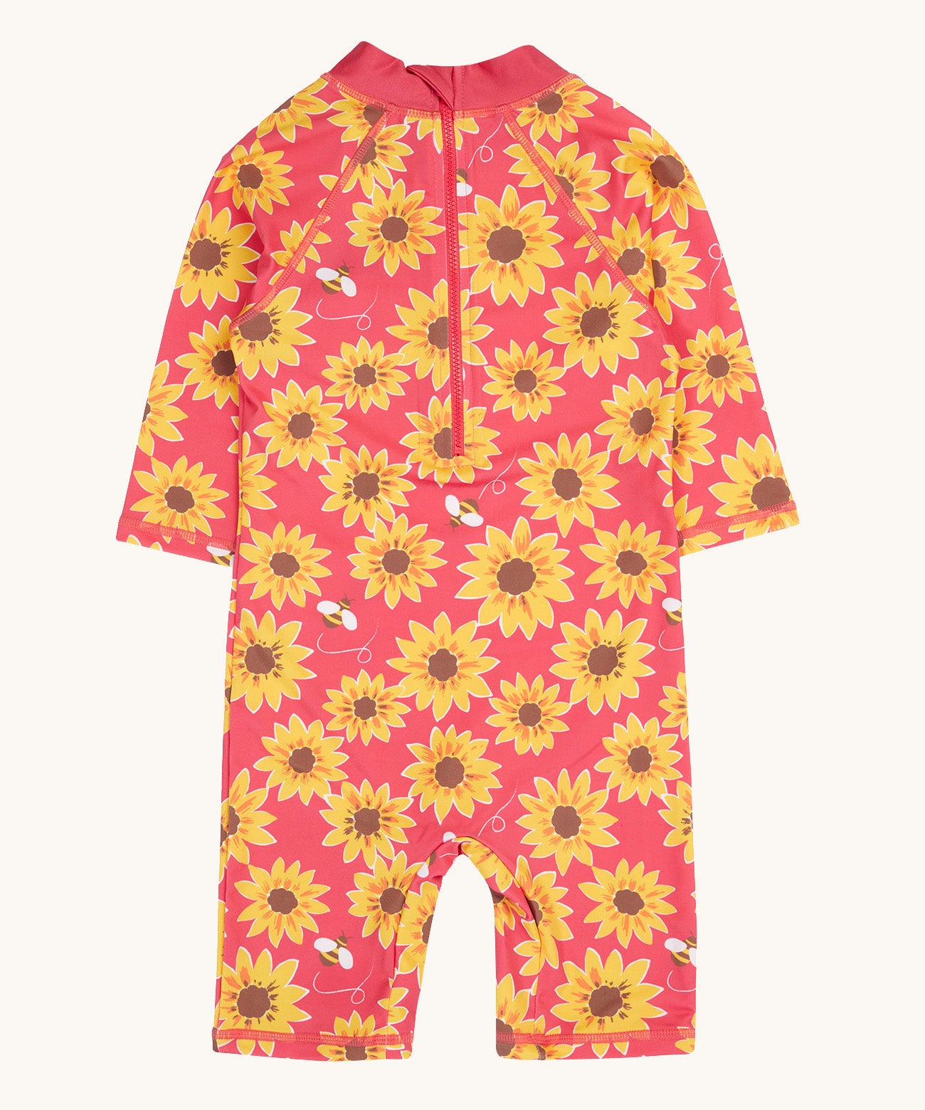 The back of the pink Frugi all in one sun safe swimwear suit with a repeating yellow sunflower and flying bee print. Features a zip from the neckline down the back