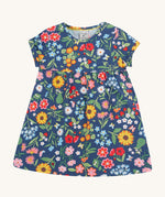 Frugi navy dress potager garden design on a cream background.