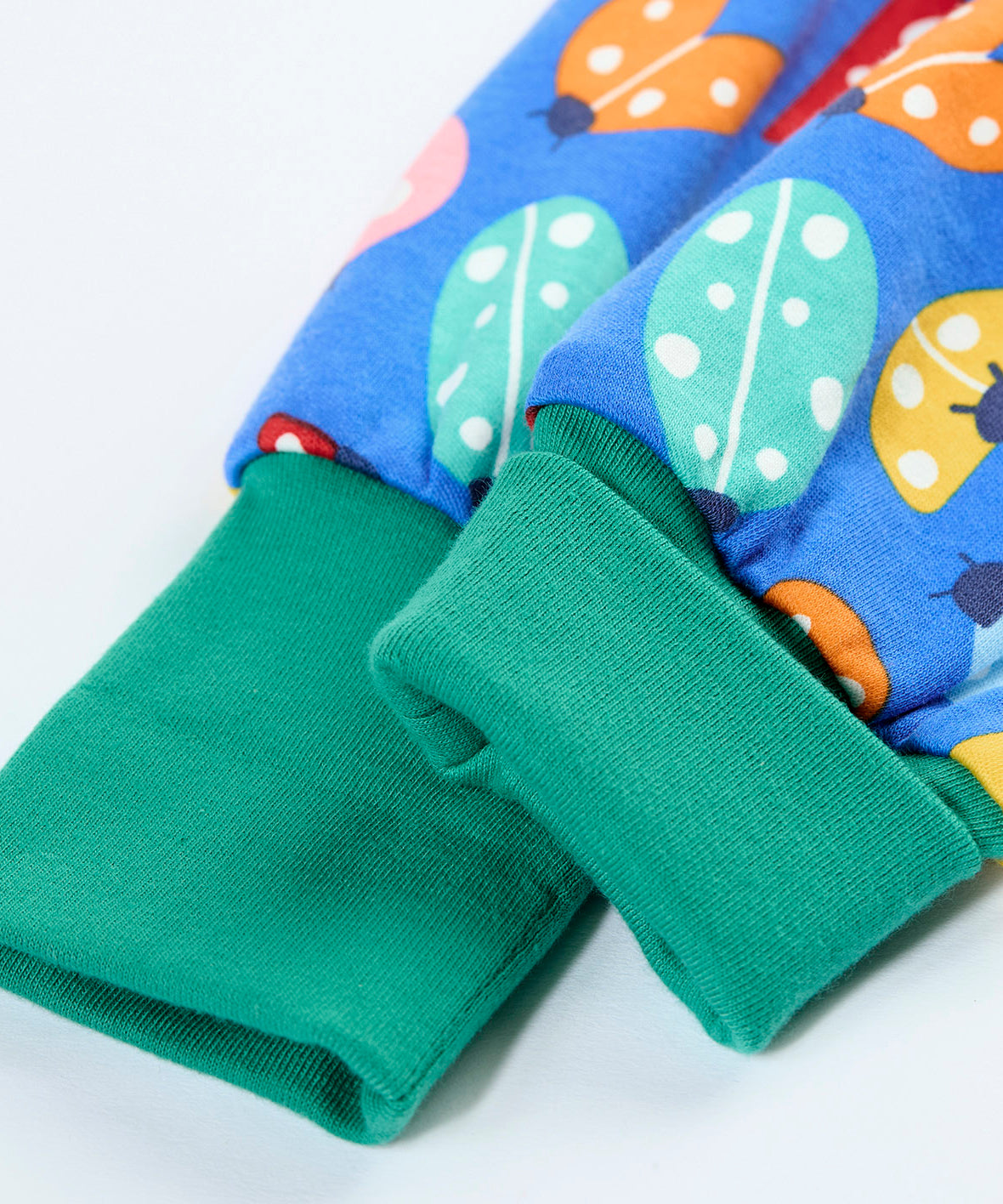 A close up of the elasticated turquoise leg cuff on the Frugi parsnip pants