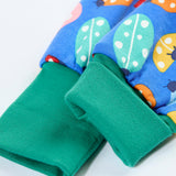 A close up of the elasticated turquoise leg cuff on the Frugi parsnip pants