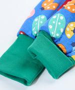 A close up of the elasticated turquoise leg cuff on the Frugi parsnip pants