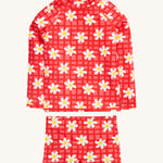 Frugi pink rash vest set daisy chain design on a cream background.