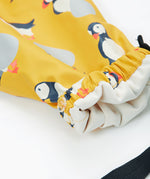 Frugi yellow puddle buster trousers puffin design leg cuff detail