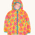 Frugi hooded rain jacket laid flat. In yellow and light blue trim with a repeating orange and pink floral print.