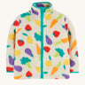 Frugi white fleece veg patch design on a cream background.