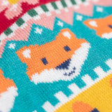 A close up of the Frugi kids robyn fairisle cardigan in fox showing the woodland inspired fairisle design detail on organic cotton fabric.